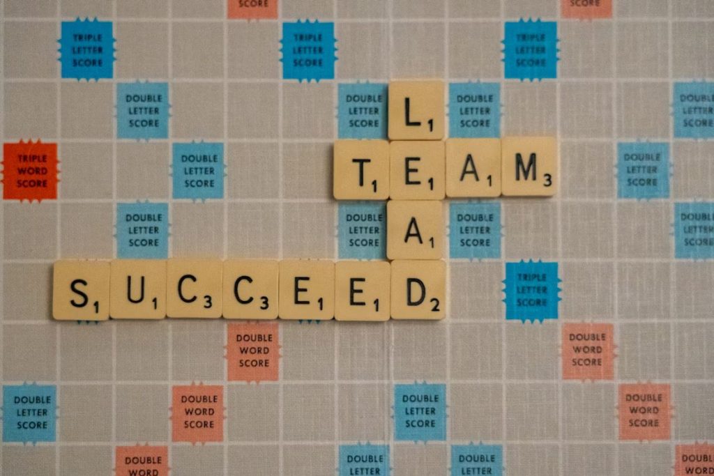 Scrabble Board With Words Related to Leader